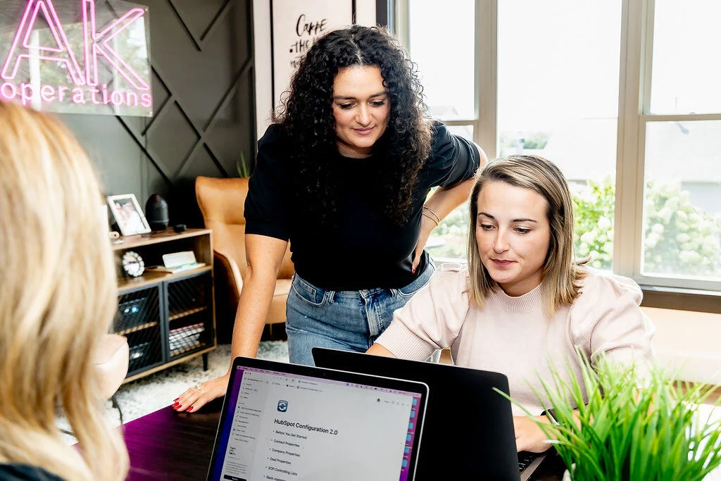 AKOps team members working together in an office